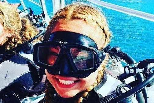 a close up of a person wearing sunglasses