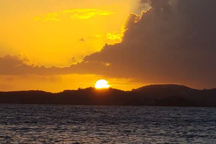 a sunset over a body of water