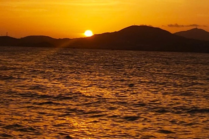 a sunset over a body of water