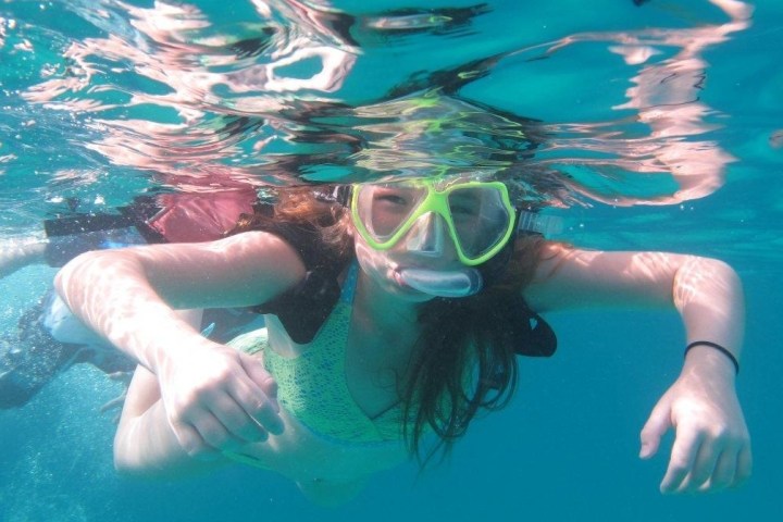 a person swimming in a pool of water