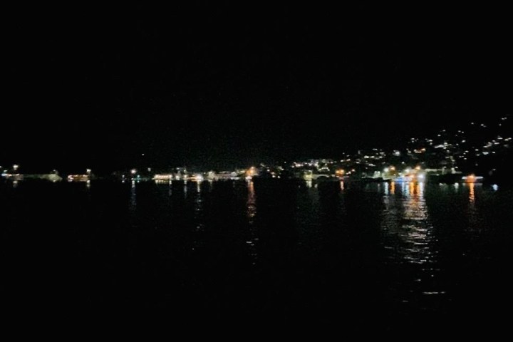 view of St Thomas at night from boat