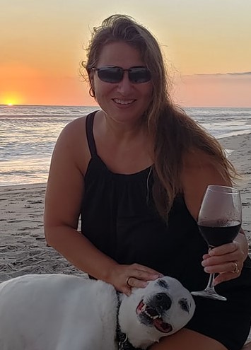 a woman sitting at a beach